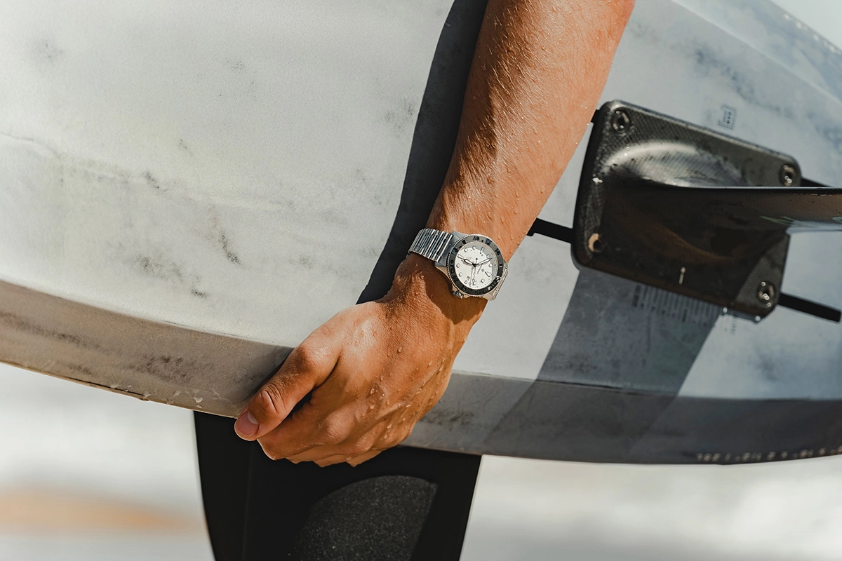 Bremont_SM500_White_Lifestyle with surfboard worn by kite surfer Tom Bridge
