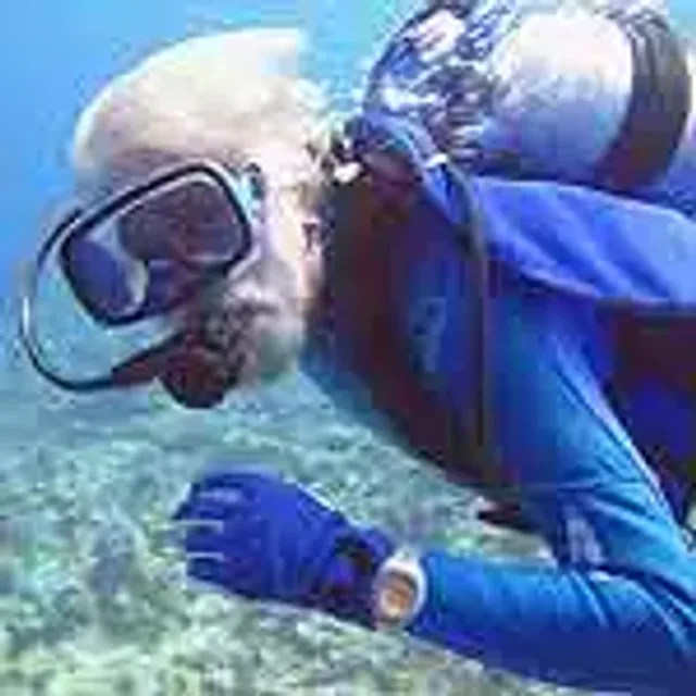 Jean Michel Cousteau diving with Doxa watch