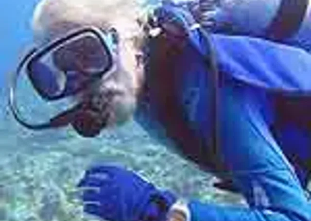 Jean Michel Cousteau diving with Doxa watch