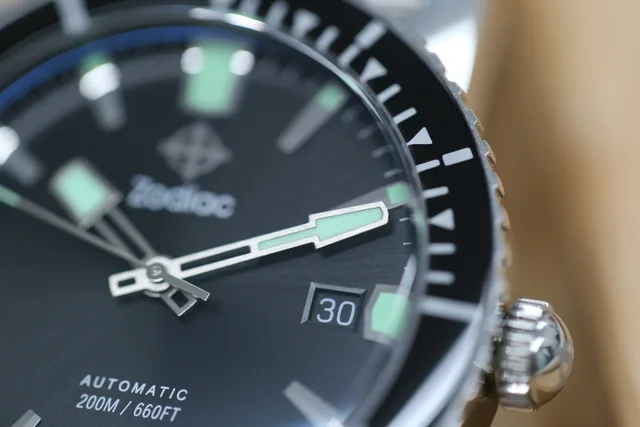 The date window is tucked in at 3 o'clock with a color-matched aperture.