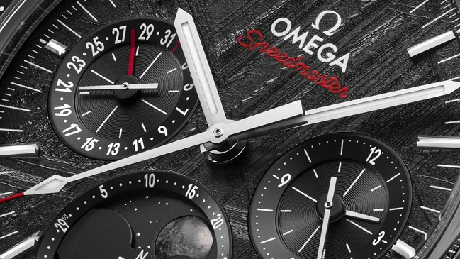 9.-OMEGA_SpeedmasterMoonphaseMeteorite_304.30.43.52.01.001