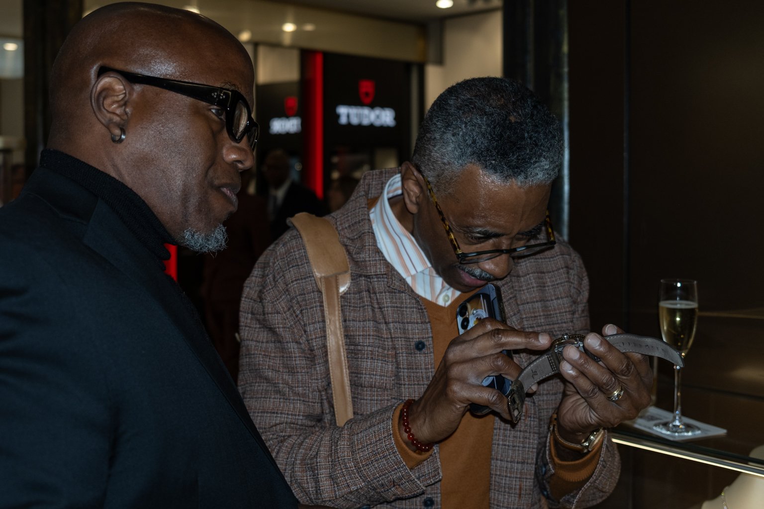 Two attendees examine a wristwatch during the 2025 WatchTime Chicago event at Burdeen’s Jewelry.