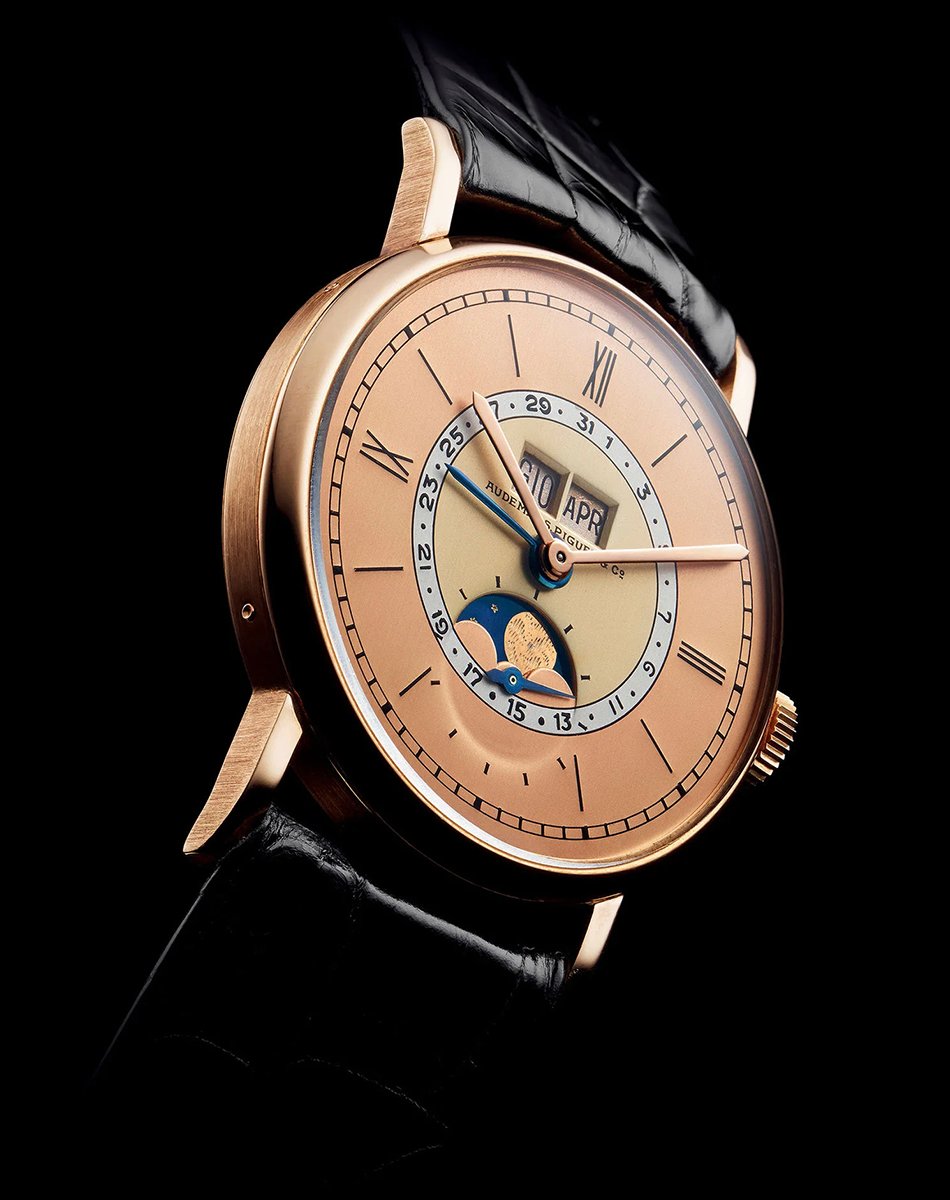 Vintage calendar watch by Audemars Piguet, gold watch with mechanical movement