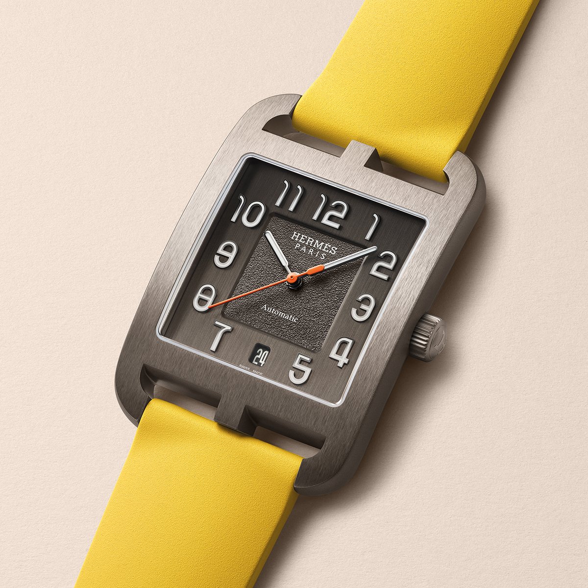 Hermès Cape Cod with a titanium case, watch with strap in yellow